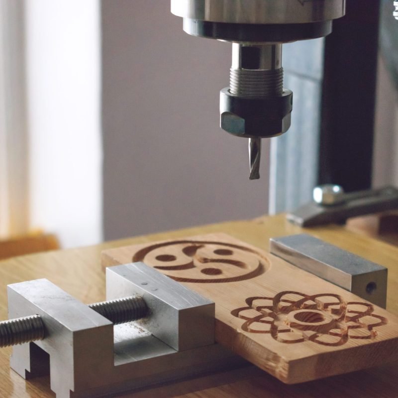 wood cutting machine 3D wood cnc router. CNC milling machine carving a wooden part blank. Cutter controlled by computer while he is carving wood.